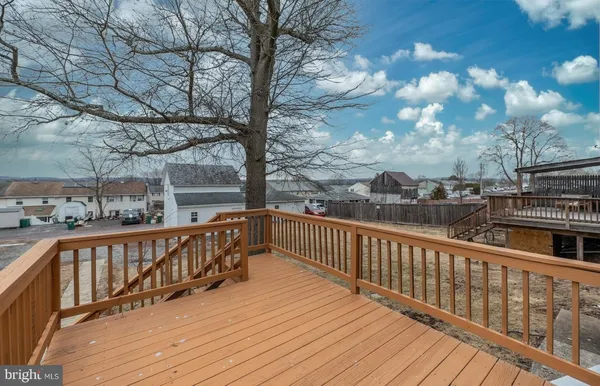 a view of wooden deck with a trees