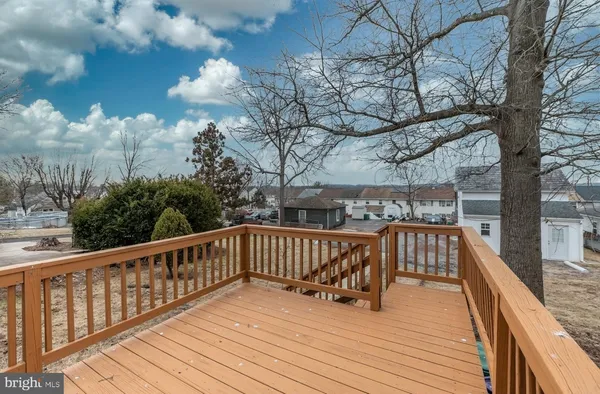 a view of deck with patio and wooden fence