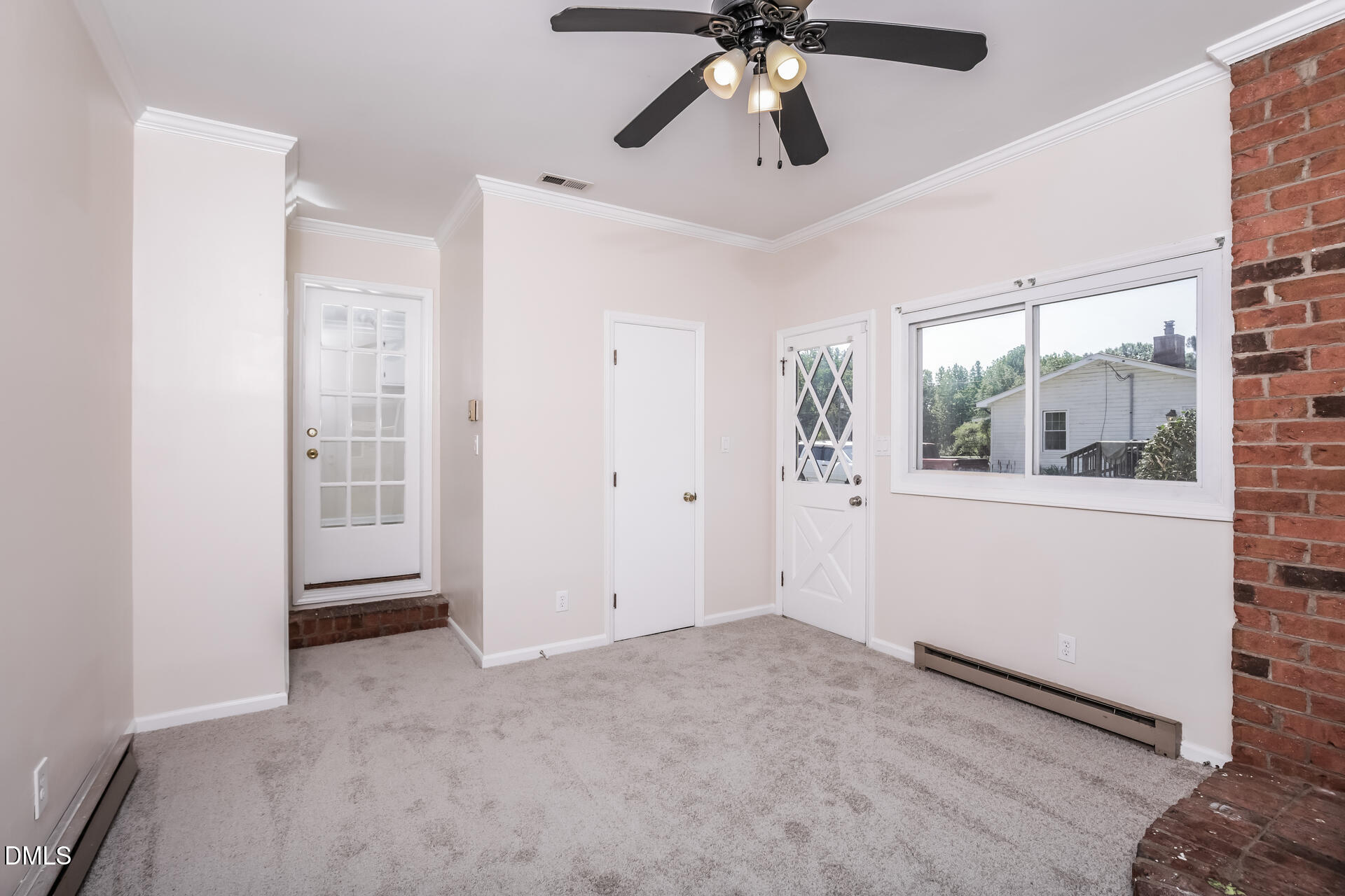 870 Abbott Road Henderson, NC 27537 - Photo 11 of 20 a view of a livingroom with a ceiling fan and window