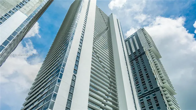 a bathroom with a toilet sink and a mirror