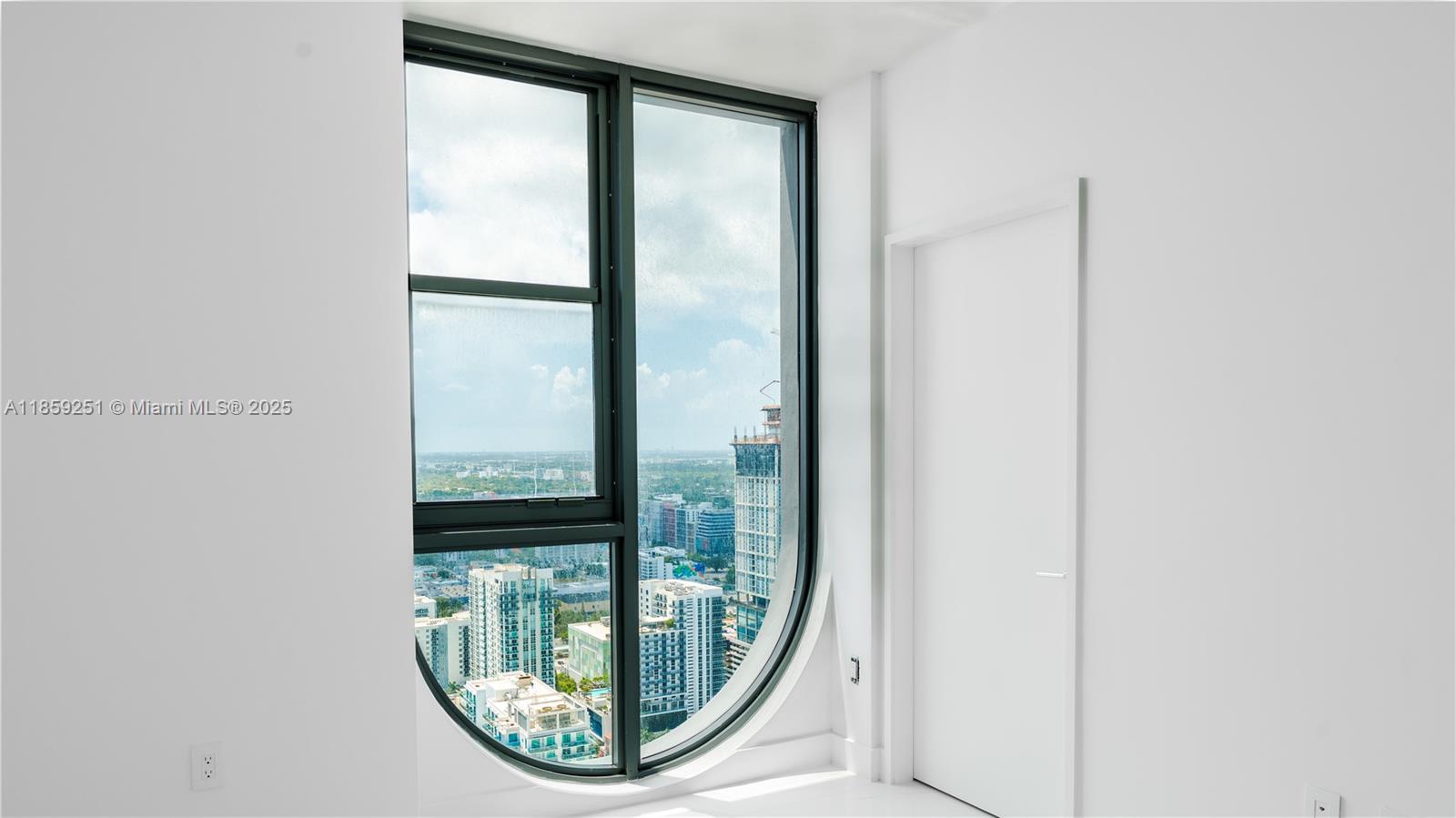 700 Northeast 24th Street, Unit 4101 Miami, FL 33137 - Photo 43 of 68 a view of a floor to ceiling window