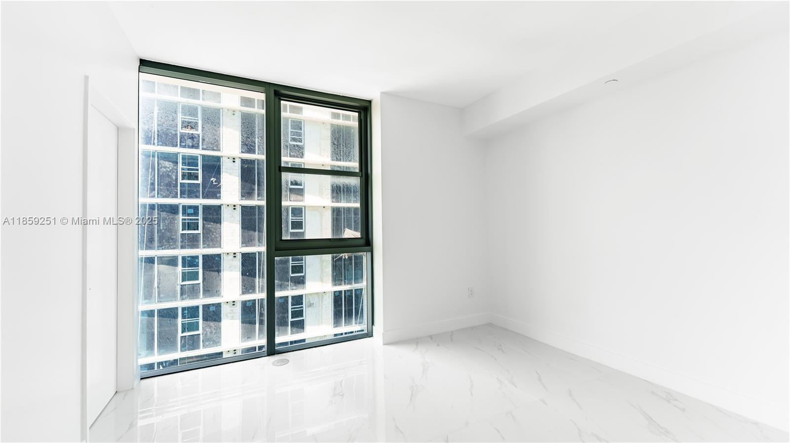 700 Northeast 24th Street, Unit 4101 Miami, FL 33137 - Photo 53 of 68 an empty room with a window