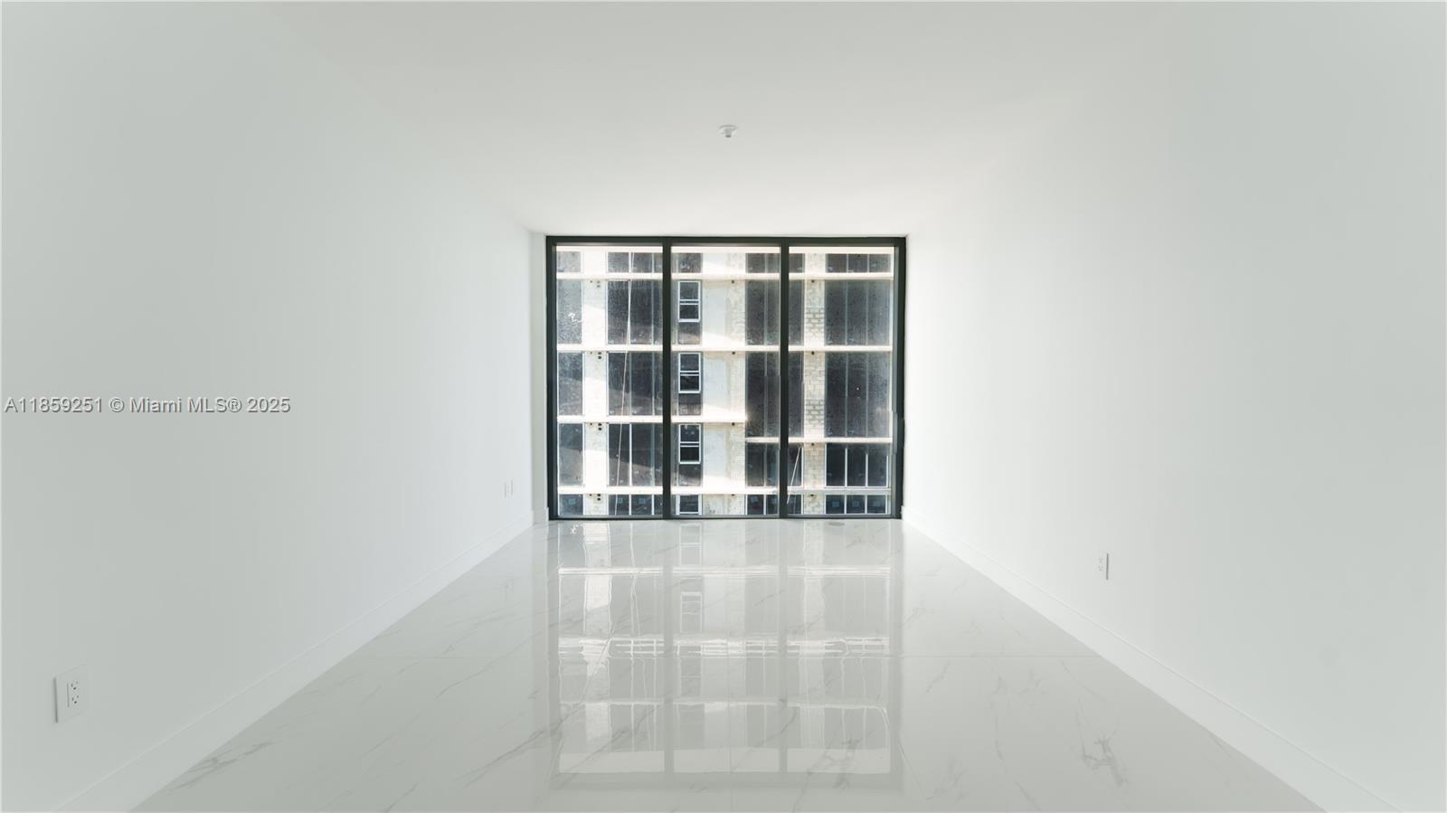 700 Northeast 24th Street, Unit 4101 Miami, FL 33137 - Photo 58 of 68 a view of empty room with windows