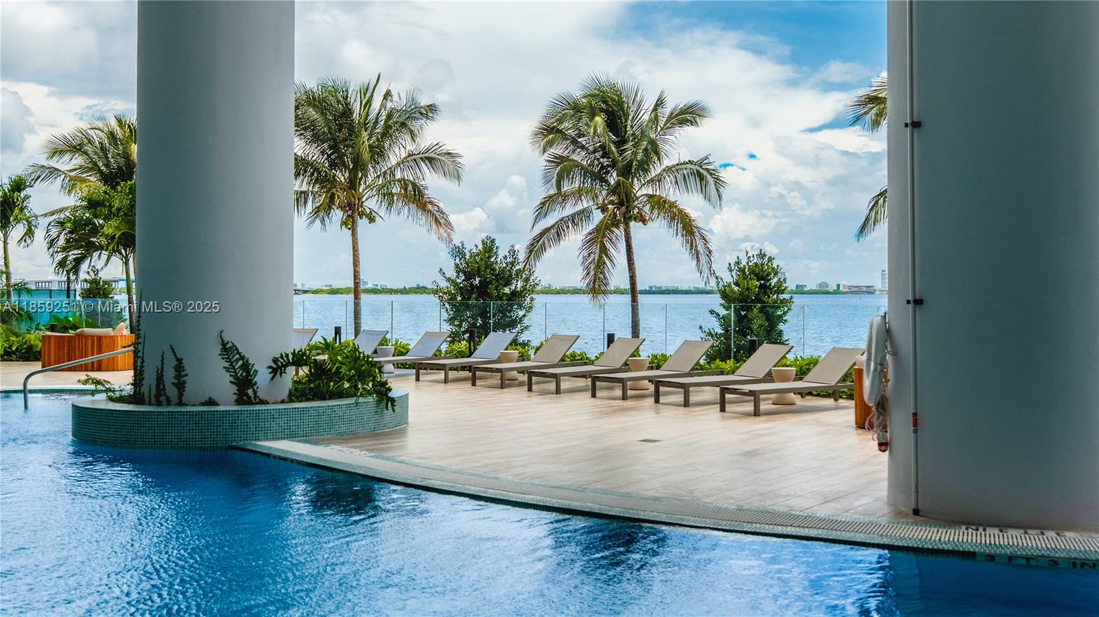 700 Northeast 24th Street, Unit 4101 Miami, FL 33137 - Photo 6 of 68 a view of a swimming pool with a lounge chair