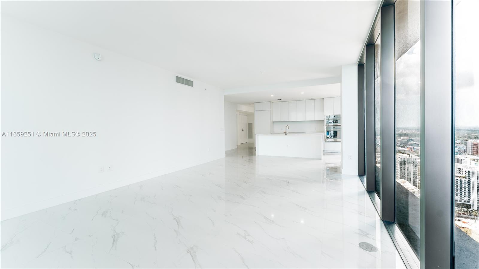 700 Northeast 24th Street, Unit 4101 Miami, FL 33137 - Photo 63 of 68 a view of a hallway with wooden floor