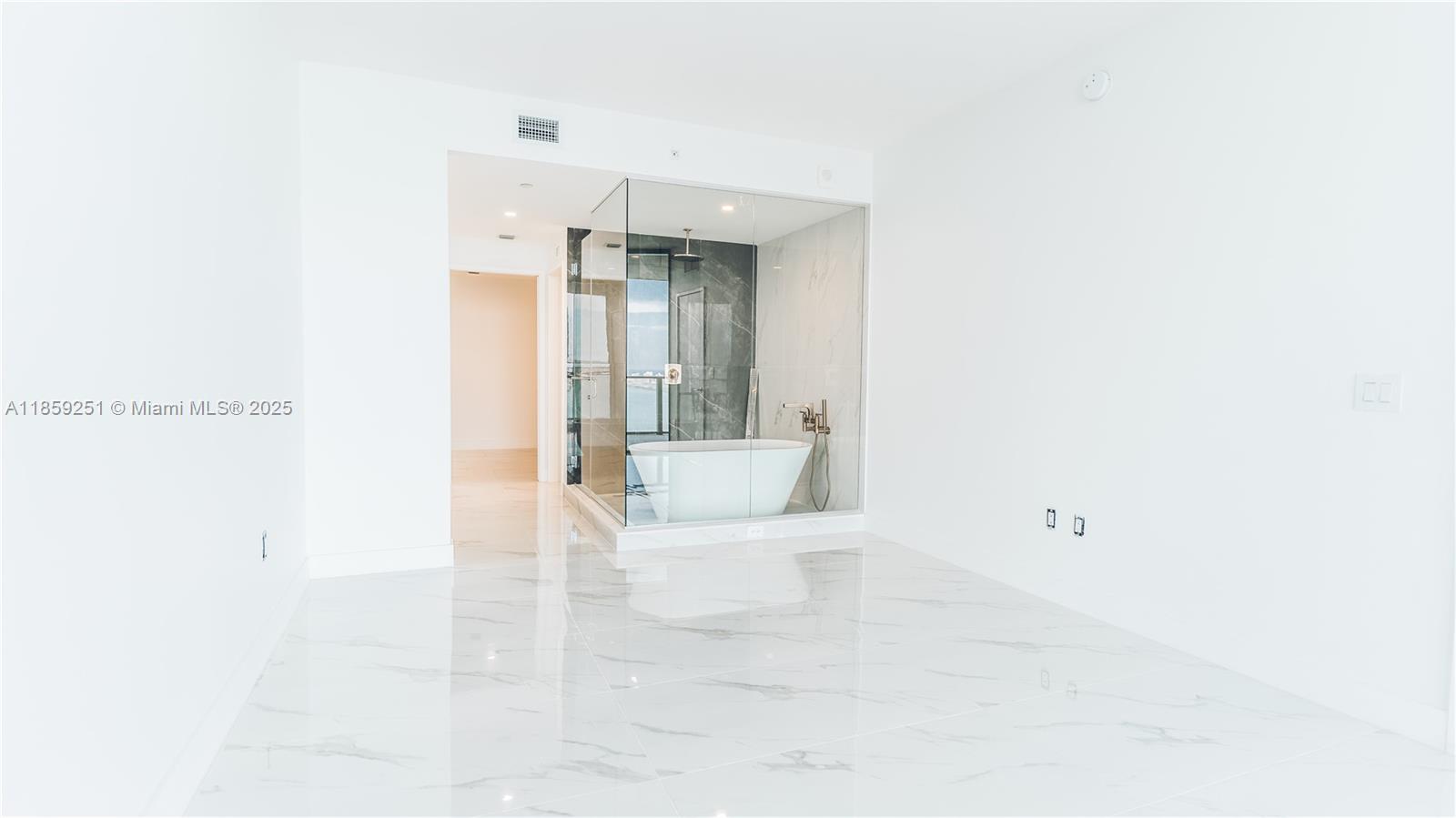 700 Northeast 24th Street, Unit 4101 Miami, FL 33137 - Photo 64 of 68 a bathroom with a bathtub and a shower