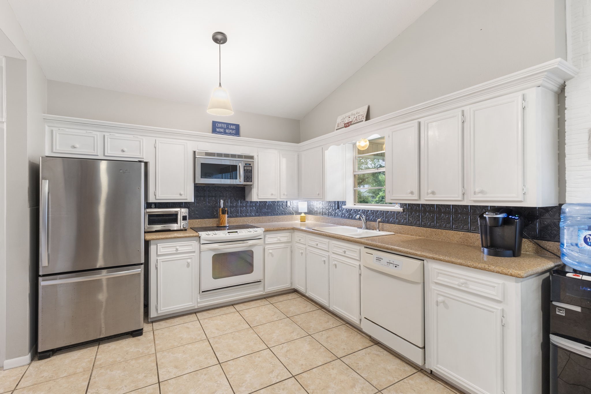 245 Lakeland Road Huntsville, TX 77320 - Photo 15 of 49 The kitchen features plenty of cabinets for storage