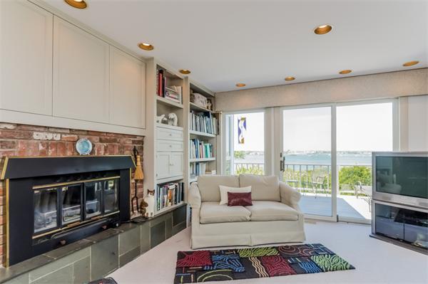 32 Crestwood Road Marblehead, MA 01945 - Photo 11 of 30 a living room with furniture a flat screen tv and a fireplace