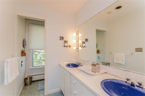 32 Crestwood Road Marblehead, MA 01945 - Photo 18 of 30 a bathroom with a granite countertop sink and a mirror
