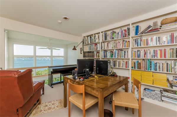 32 Crestwood Road Marblehead, MA 01945 - Photo 21 of 30 a view of a workspace with furniture and a book shelf