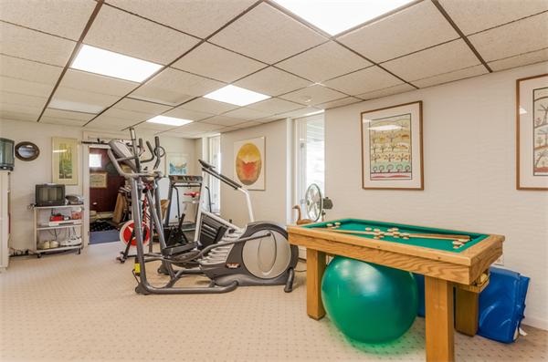 32 Crestwood Road Marblehead, MA 01945 - Photo 22 of 30 a room with gym equipment and large mirror