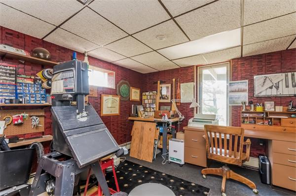 32 Crestwood Road Marblehead, MA 01945 - Photo 23 of 30 a living room with furniture a flat screen tv and a refrigerator