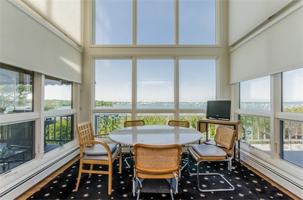 32 Crestwood Road Marblehead, MA 01945 - Photo 10 of 30 a view of a dining room with furniture large windows and wooden floor