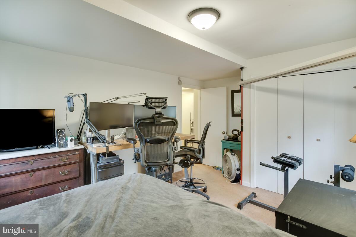 2546 Aster Road Port Republic, MD 20676 - Photo 48 of 54 a view of a workspace with furniture and a flat screen tv
