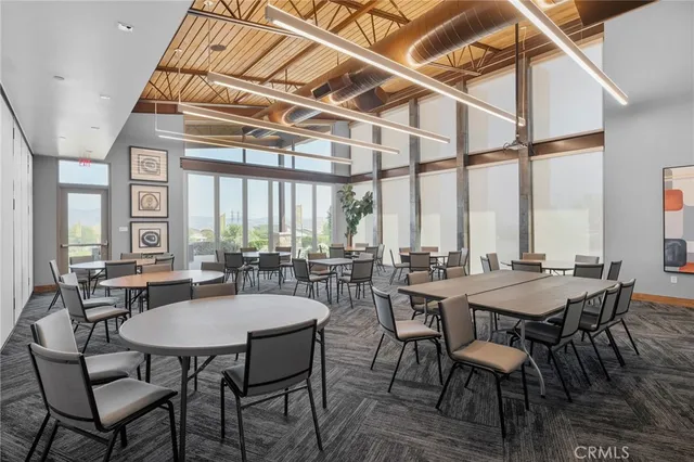 a view of a patio with couches chairs and a yard