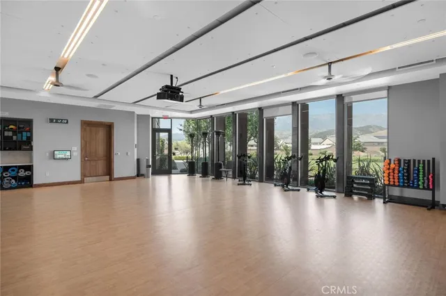 a front view of a house with a garden and patio