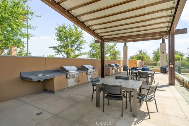 a view of a backyard with sitting area