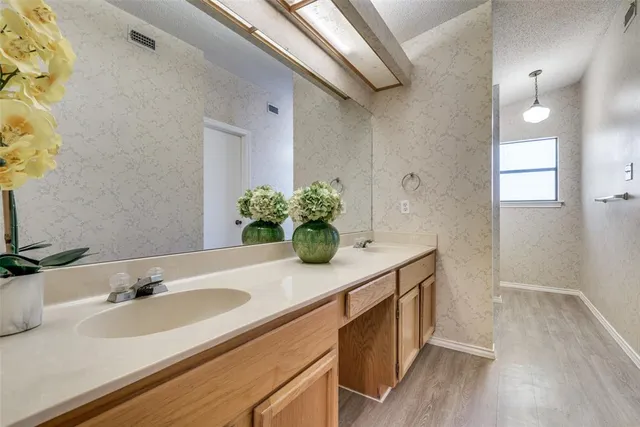 a bathroom with a sink and a mirror