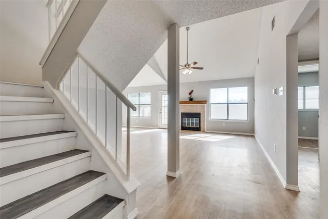 a view of staircase with white walls and windows