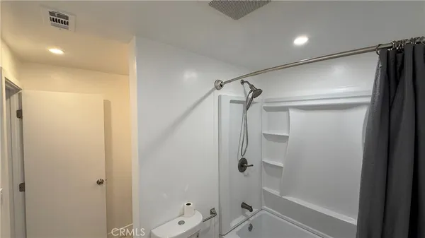 a bathroom with a sink and shower