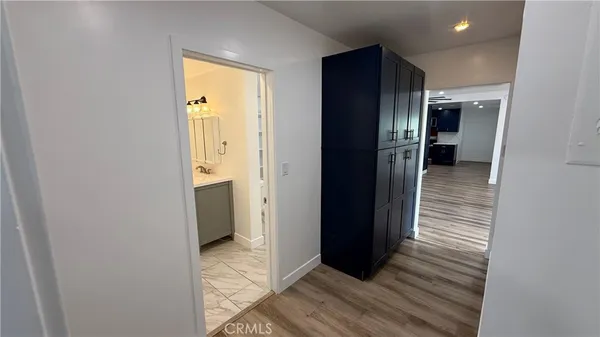 a bathroom with a sink a mirror and a vanity