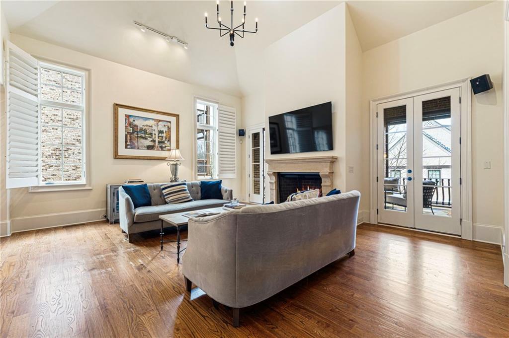 3751 Paces Lookout Circle Southeast Atlanta, GA 30339 - Photo 11 of 39 a living room with furniture a flat screen tv and a fireplace