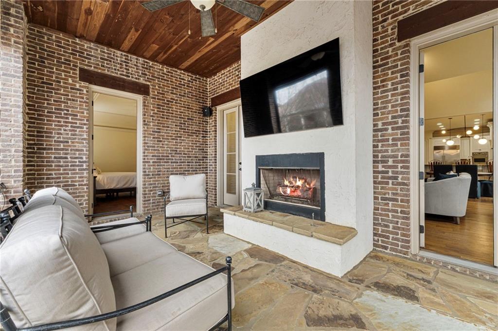 3751 Paces Lookout Circle Southeast Atlanta, GA 30339 - Photo 12 of 39 a living room with furniture a flat screen tv and a fireplace