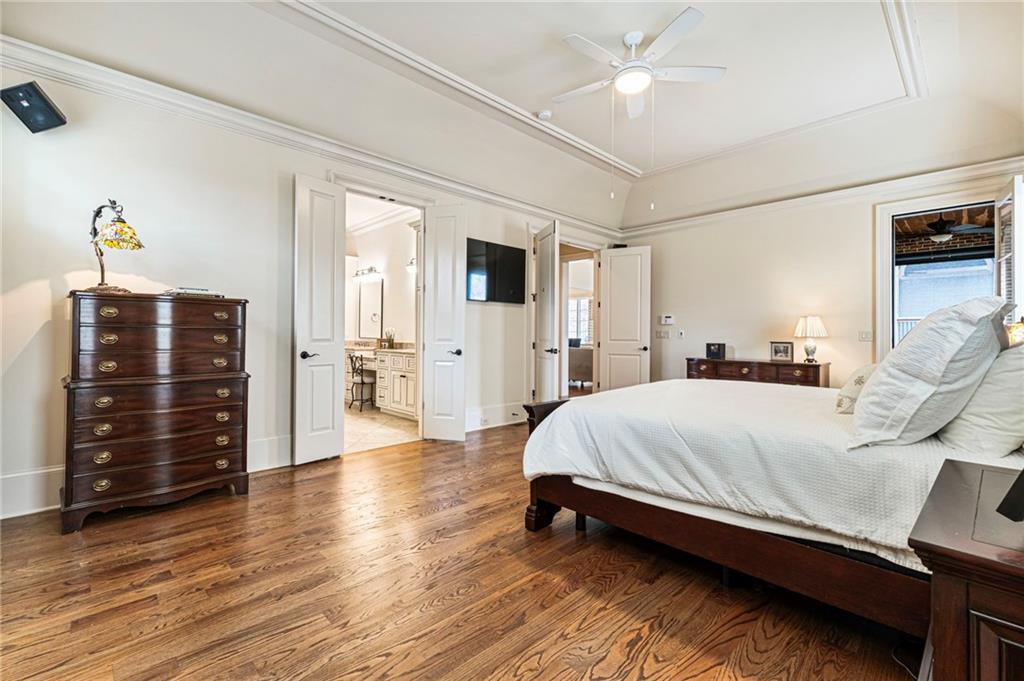 3751 Paces Lookout Circle Southeast Atlanta, GA 30339 - Photo 15 of 39 a spacious bedroom with a bed and wooden floor