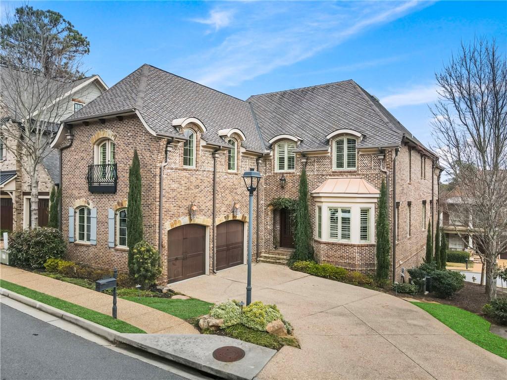 3751 Paces Lookout Circle Southeast Atlanta, GA 30339 - Photo 2 of 39 a front view of a house with a garden