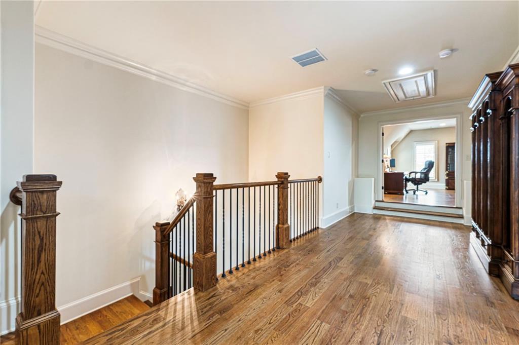 3751 Paces Lookout Circle Southeast Atlanta, GA 30339 - Photo 22 of 39 a view of a hallway to a livingroom with wooden floor and furniture