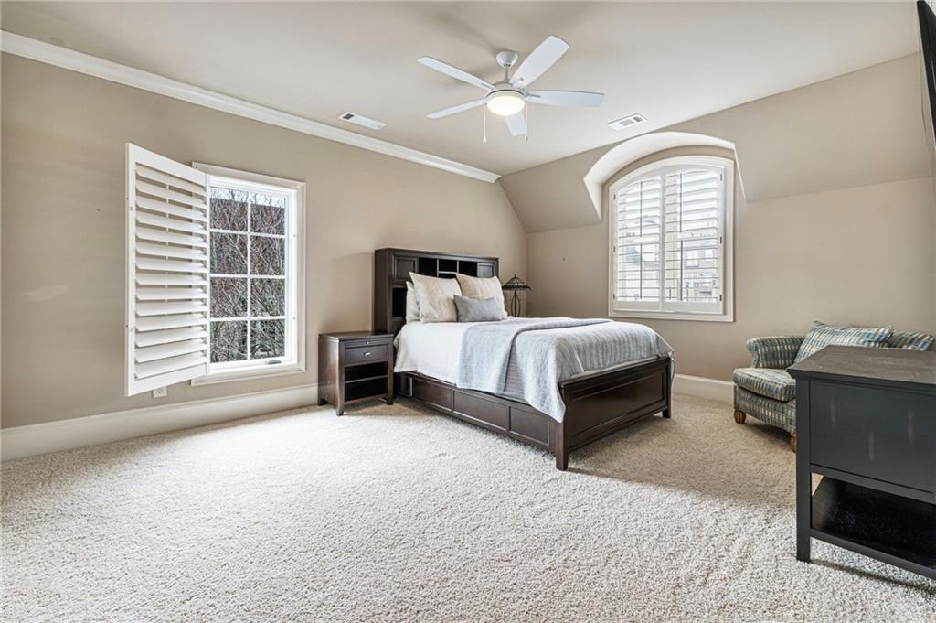 3751 Paces Lookout Circle Southeast Atlanta, GA 30339 - Photo 28 of 39 a spacious bedroom with a bed and a window