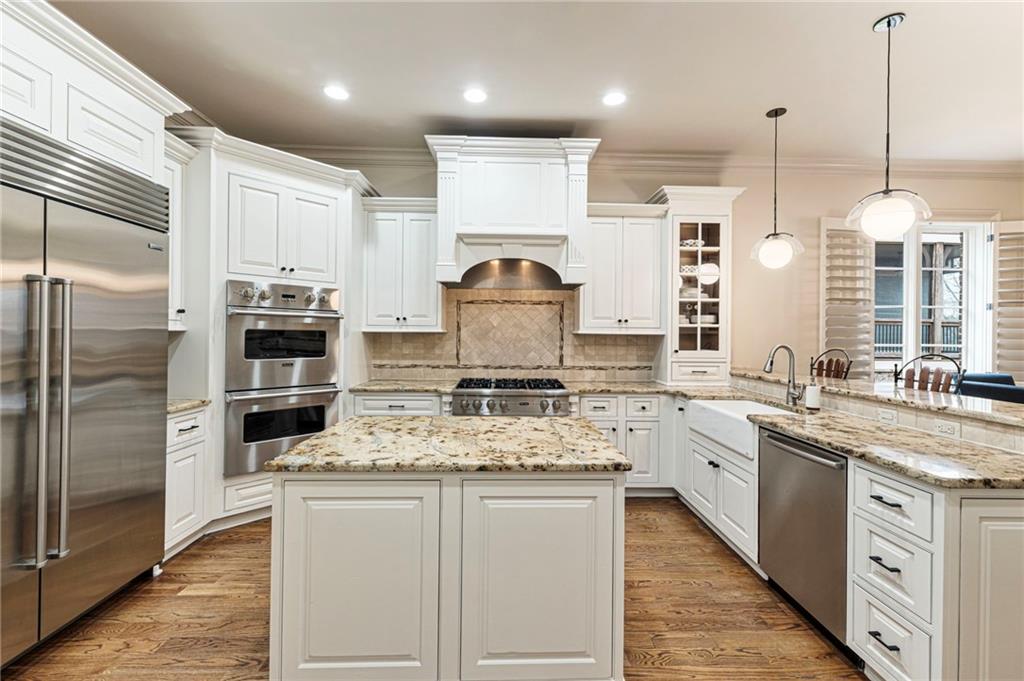 3751 Paces Lookout Circle Southeast Atlanta, GA 30339 - Photo 5 of 39 a kitchen with stainless steel appliances granite countertop a stove sink and refrigerator