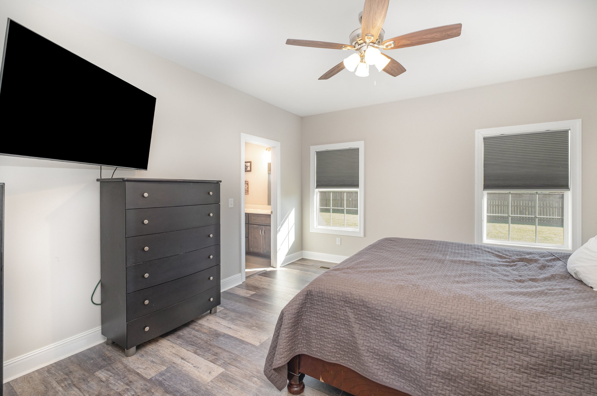 8903 Covington Road White House, TN 37188 - Photo 18 of 36 a bedroom with a bed and a flat screen tv