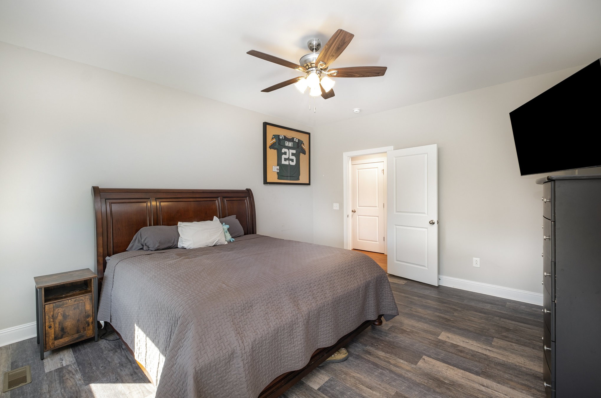 8903 Covington Road White House, TN 37188 - Photo 19 of 36 a bedroom with a bed and a flat screen tv