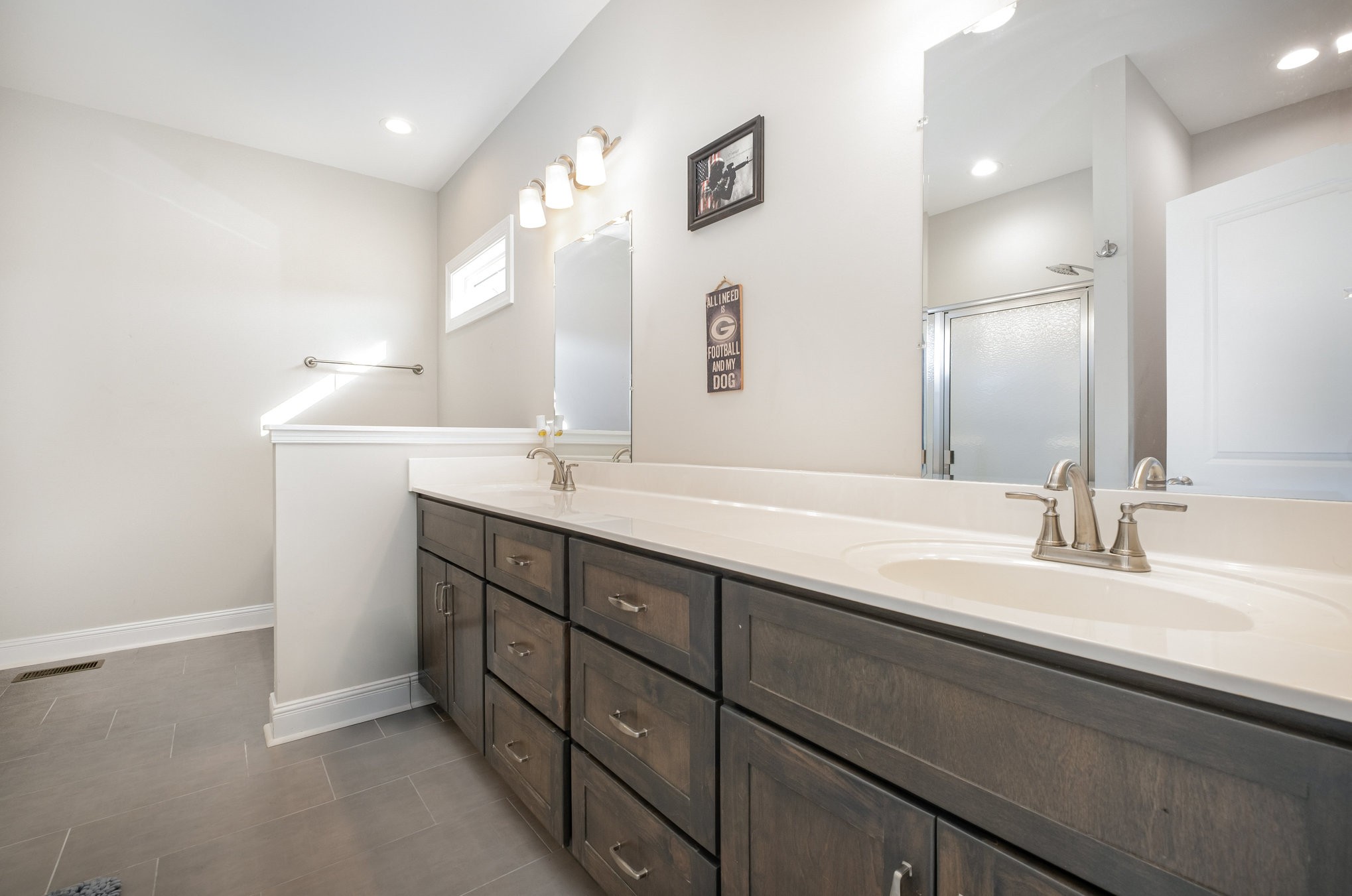 8903 Covington Road White House, TN 37188 - Photo 22 of 36 a bathroom with a double vanity sink and a mirror