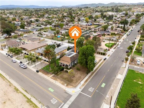 an aerial view of residential houses with outdoor space