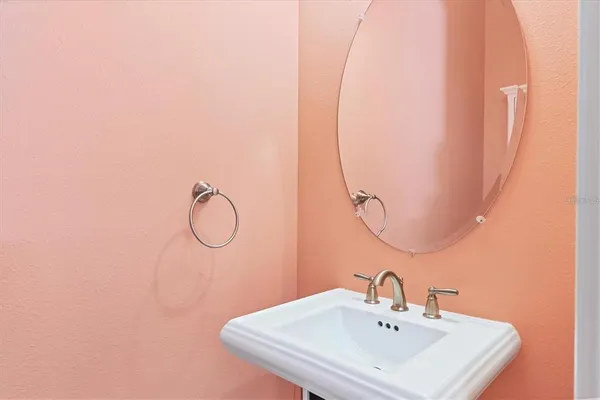 a bathroom with a sink and mirror