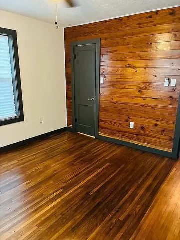 a view of front door with wooden floor