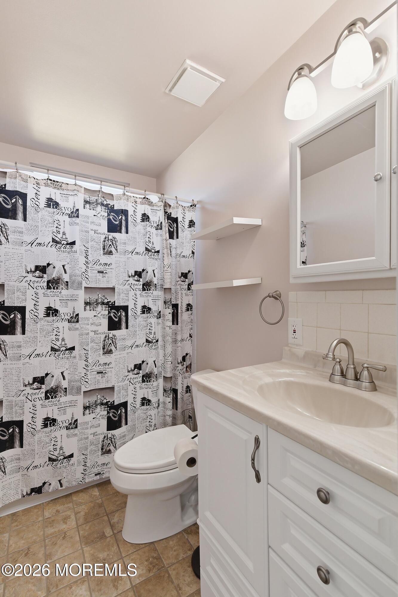 8 Hummingbird Lane Whiting, NJ 08759 - Photo 11 of 41 a bathroom with a sink a toilet and a mirror
