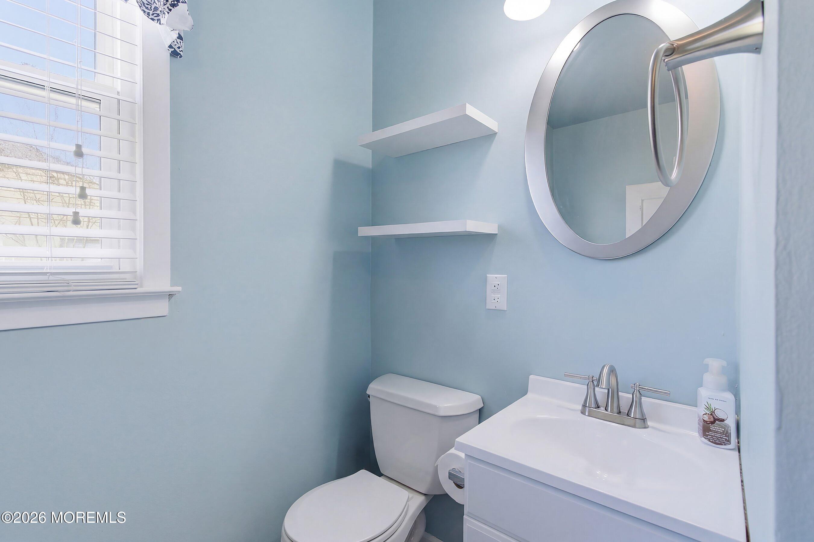 8 Hummingbird Lane Whiting, NJ 08759 - Photo 14 of 41 a bathroom with a toilet sink and mirror