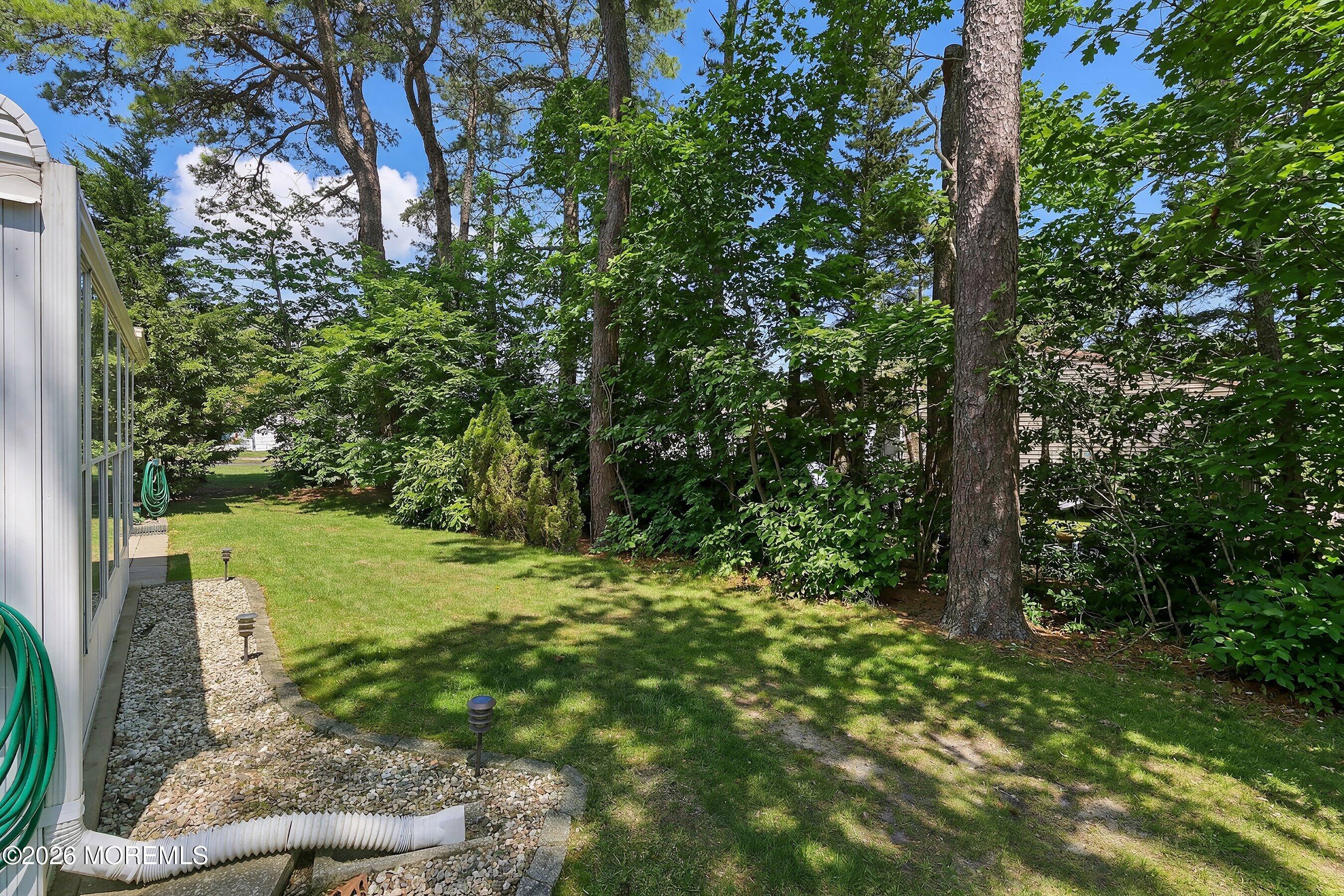 8 Hummingbird Lane Whiting, NJ 08759 - Photo 20 of 41 a view of a yard with large trees