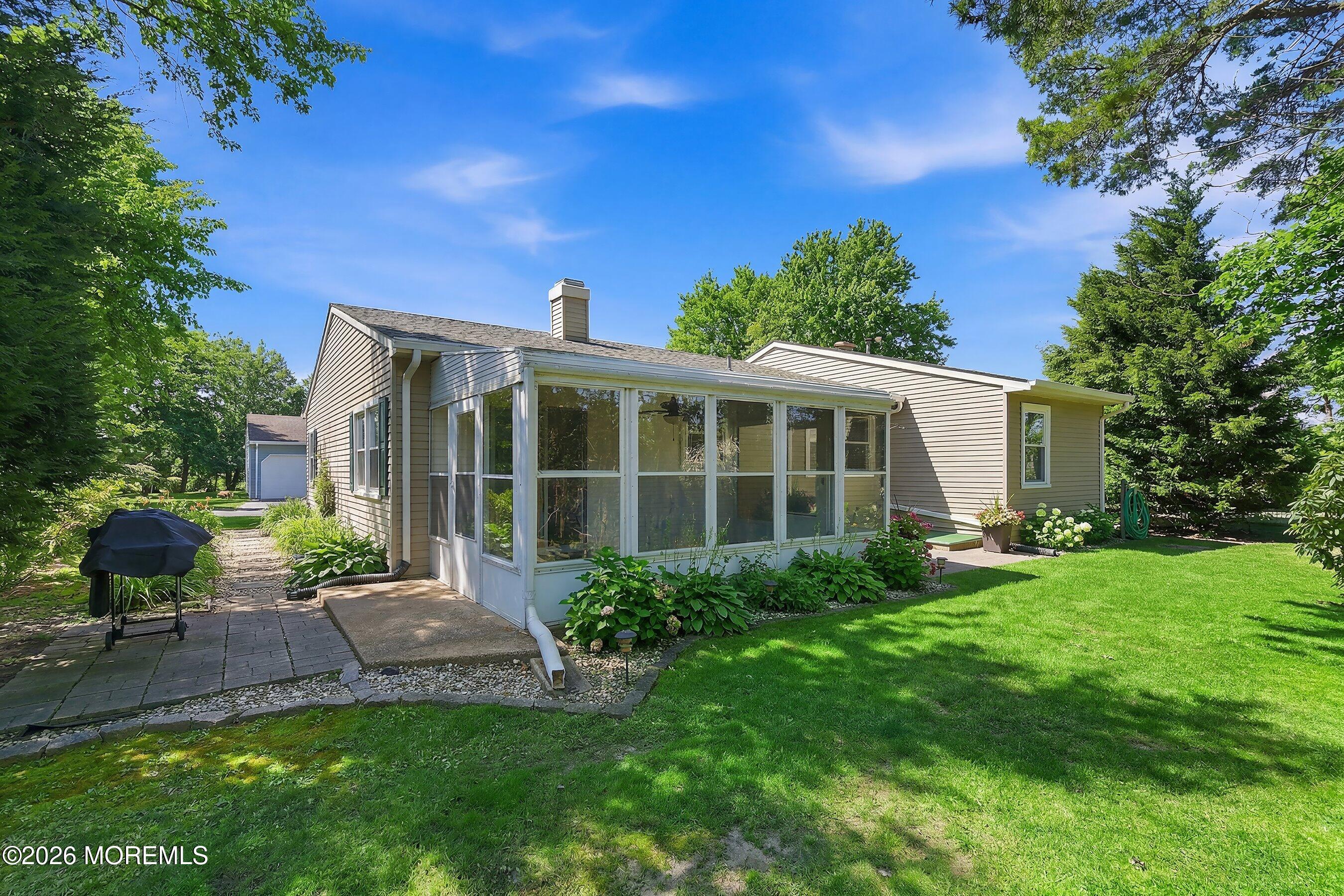 8 Hummingbird Lane Whiting, NJ 08759 - Photo 22 of 41 a view of a house with backyard sitting area and garden
