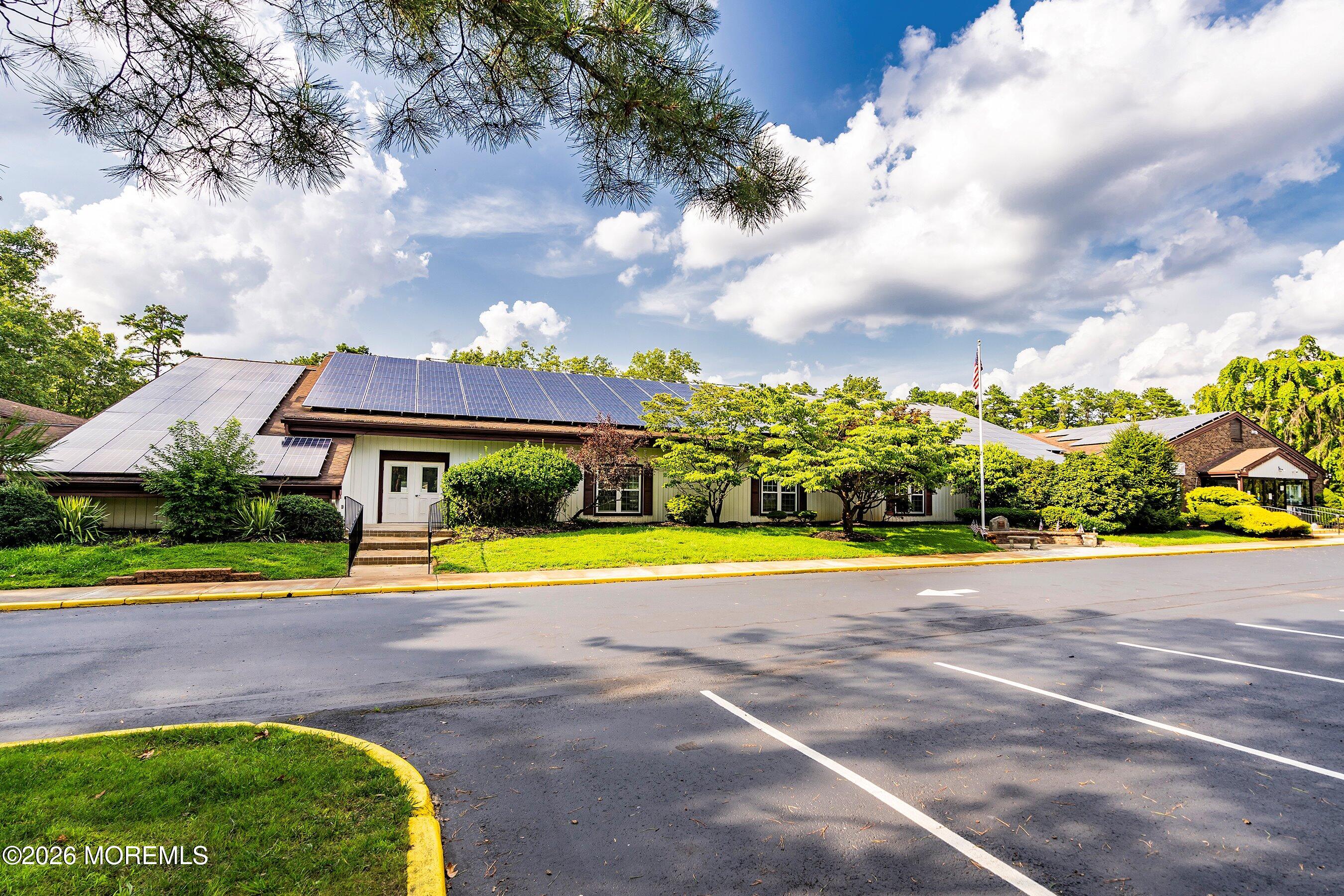 8 Hummingbird Lane Whiting, NJ 08759 - Photo 25 of 41 a view of a swimming pool with a yard and plants