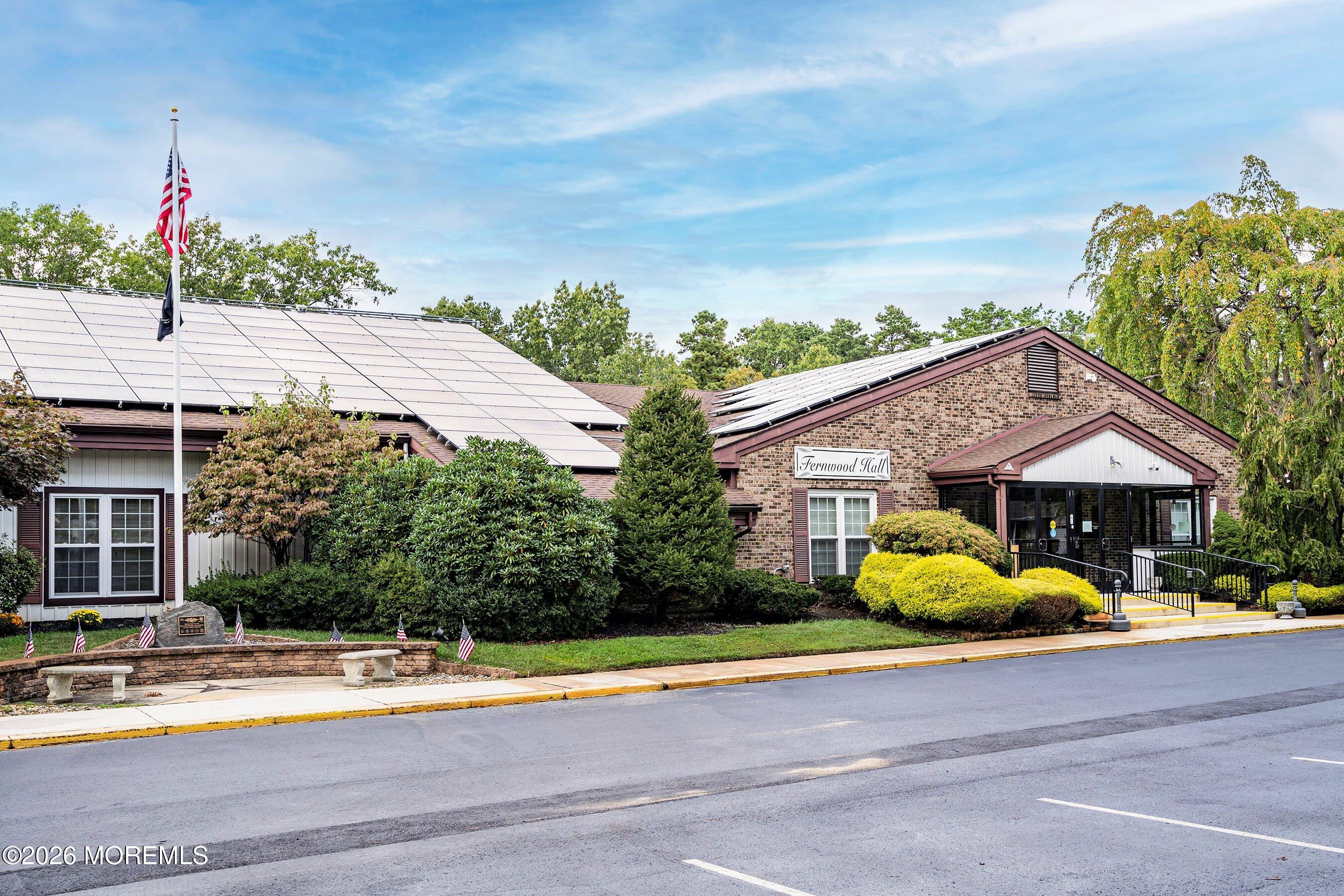 8 Hummingbird Lane Whiting, NJ 08759 - Photo 27 of 41 a front view of a house with a garden and trees