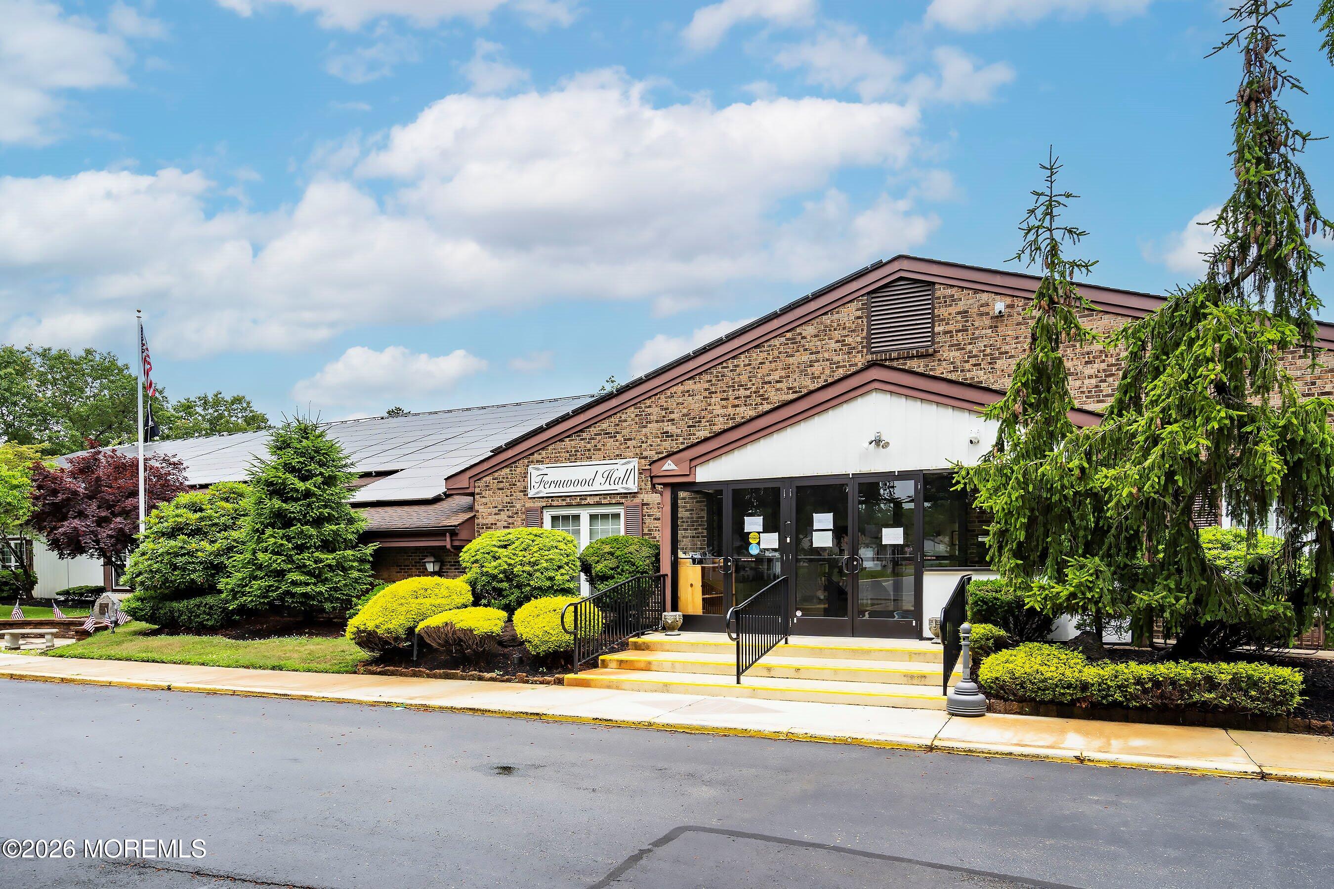 8 Hummingbird Lane Whiting, NJ 08759 - Photo 28 of 41 a view of a house with a large windows and a table and chairs
