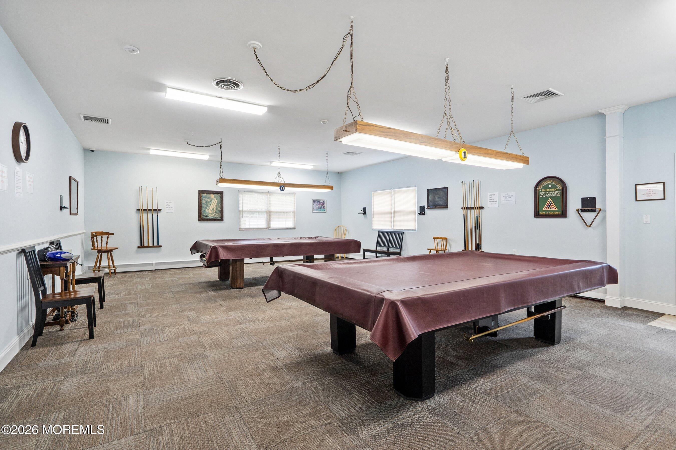8 Hummingbird Lane Whiting, NJ 08759 - Photo 31 of 41 a spacious bedroom with a table chairs and a large mirror