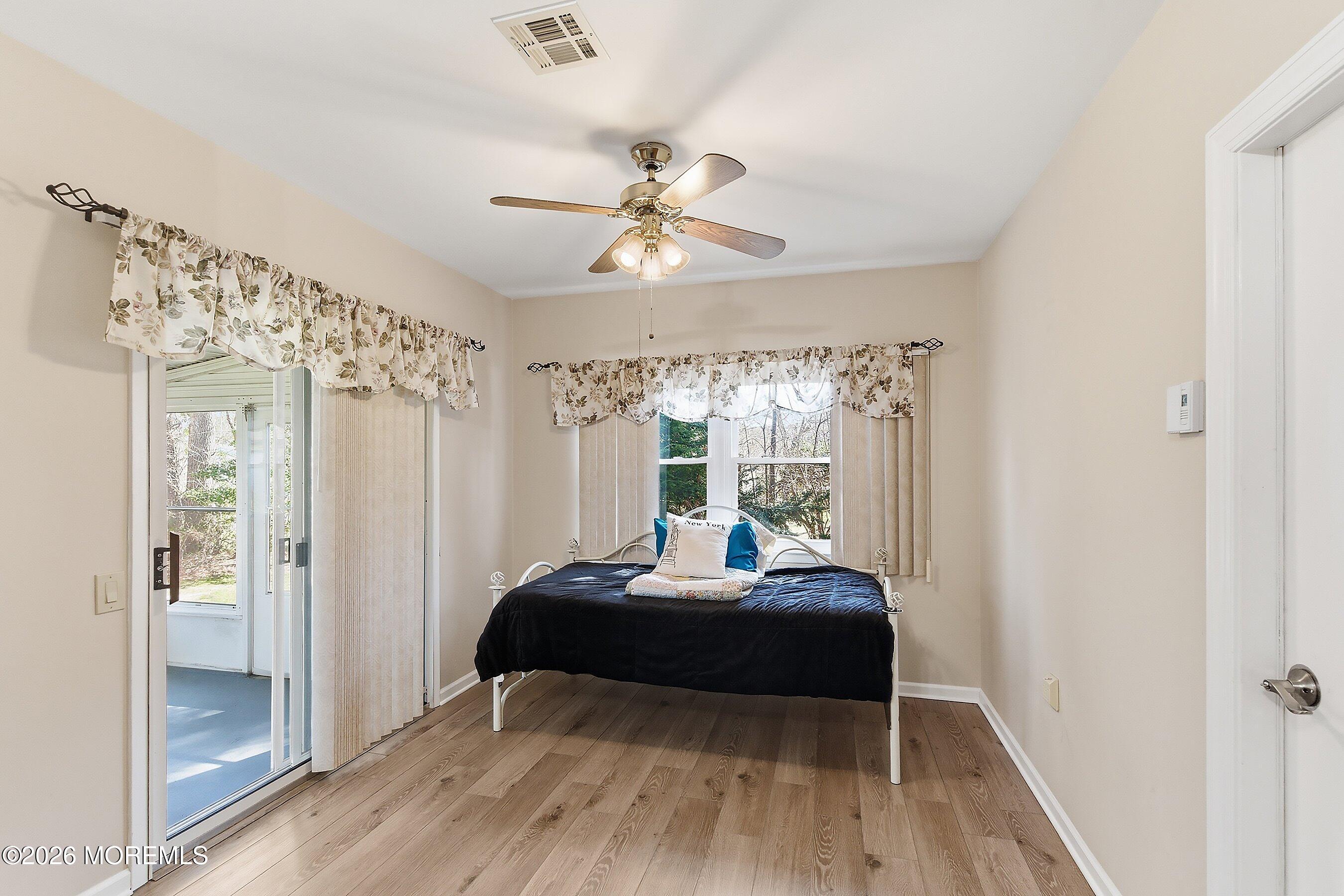 8 Hummingbird Lane Whiting, NJ 08759 - Photo 7 of 41 a bedroom with a bed and a large window