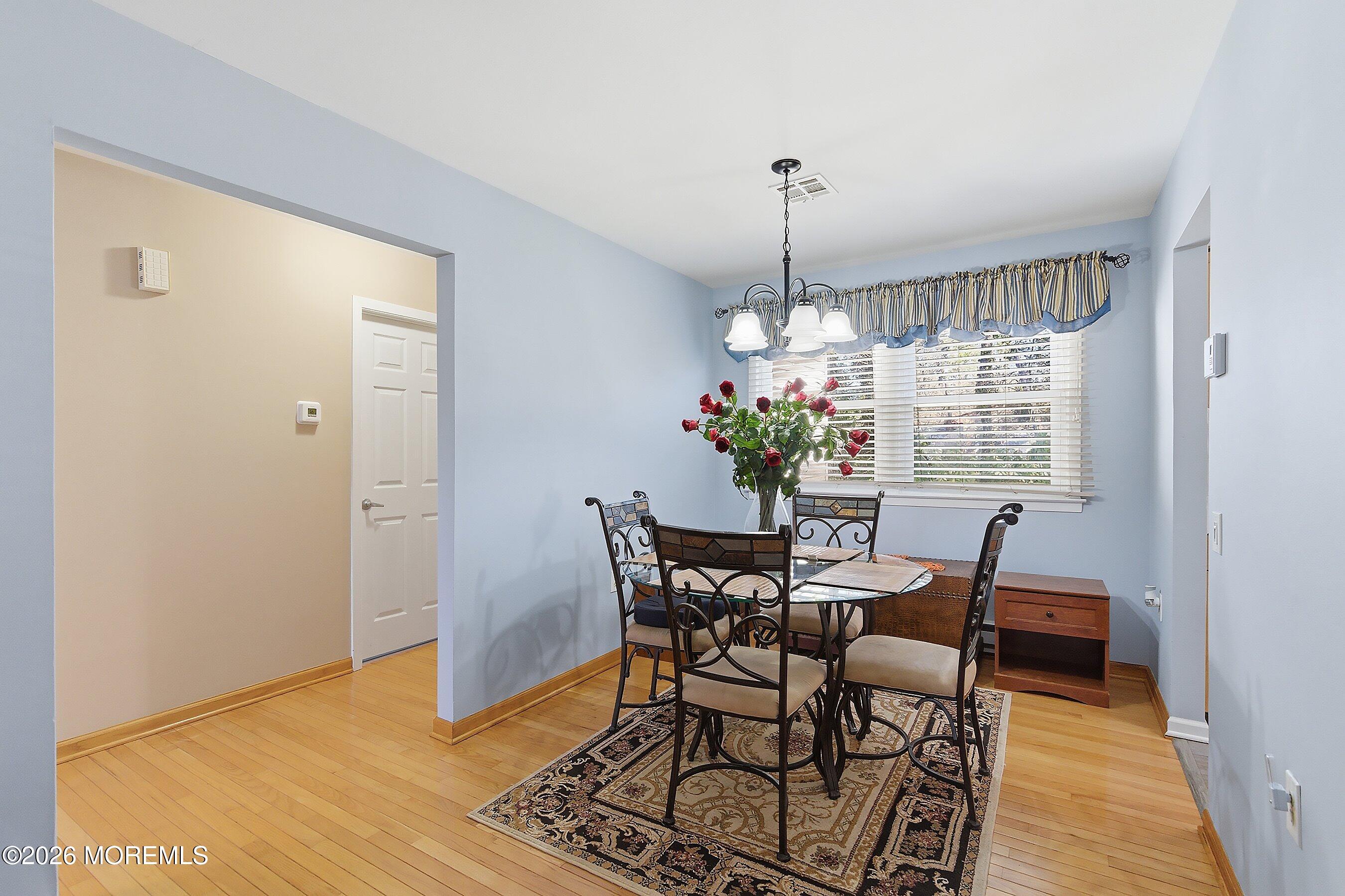 8 Hummingbird Lane Whiting, NJ 08759 - Photo 9 of 41 a view of a dining room with furniture window and wooden floor