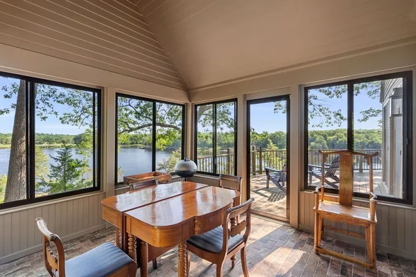 a dining room with furniture window and outside view