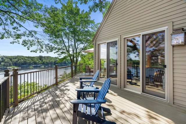 a view of a patio with a table chairs and backyard